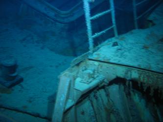 Aft end of hinge mechanism for concealment of stbd fwd 5.9-inch gun